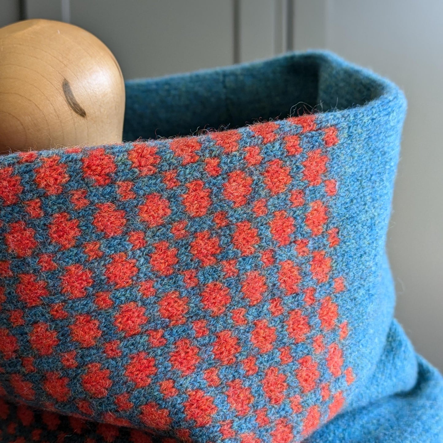 Lambswool knitted Fair Isle cowl in dots and spots design - blue with orange spots