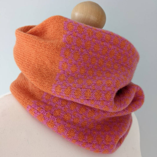 Lambswool knitted Fairisle cowl in dots and spots design - orange and pink