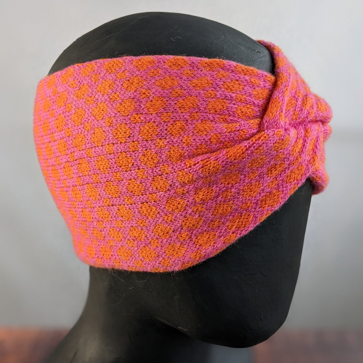 Merino wool ear warmer knitted headband dots and spots design in bubblegum pink and orange