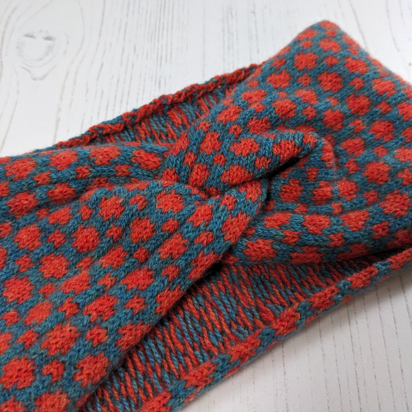 Merino wool ear warmer knitted headband dots and spots design in orange and blue