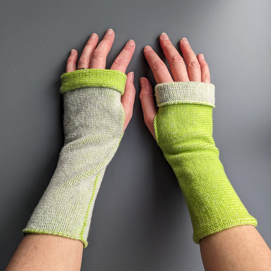 Knitted lambswool reversible wrist warmers in lime green and pale grey