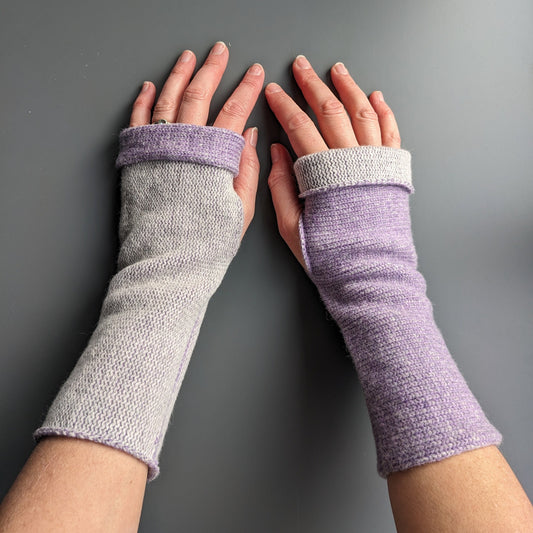 Knitted lambswool reversible wrist warmers in lilac and pale grey
