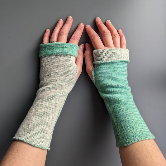 Knitted lambswool reversible wrist warmers in mint green and linen