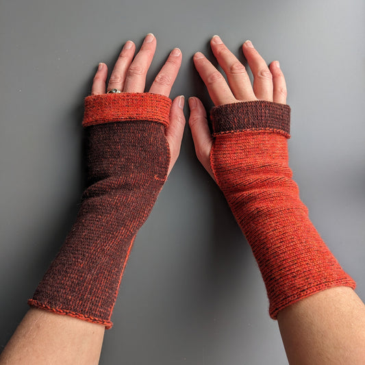 Knitted lambswool reversible wrist warmers in orange and brown